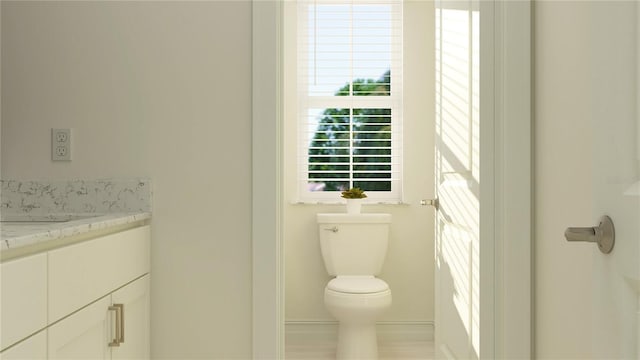 bathroom with toilet and vanity