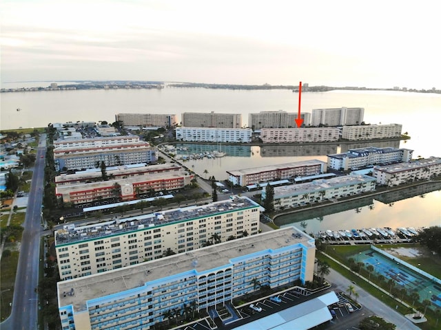 birds eye view of property featuring a view of city and a water view