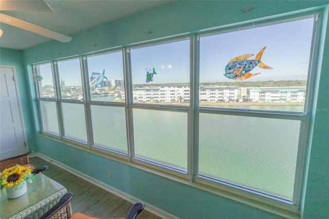 unfurnished sunroom with a city view