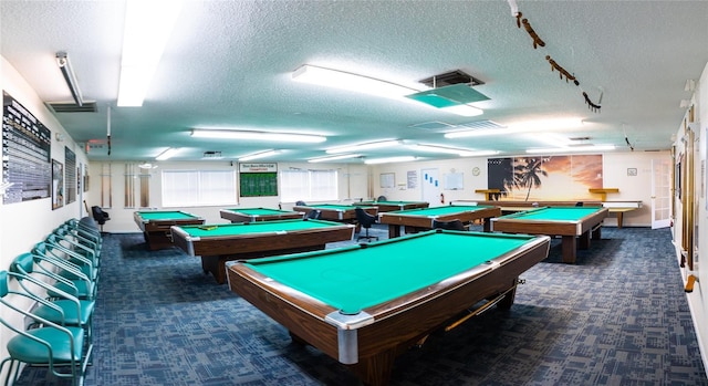 playroom featuring carpet floors, pool table, and a textured ceiling