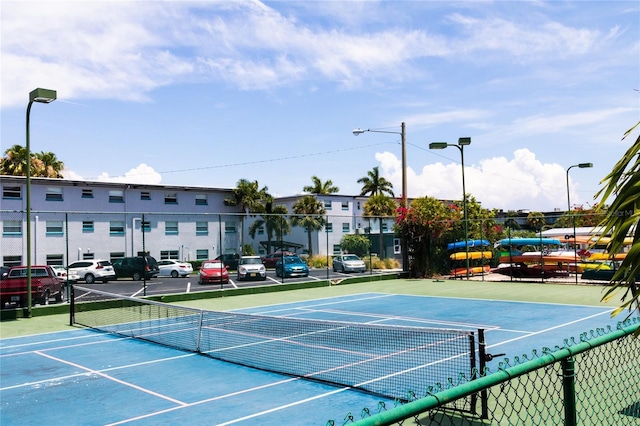 view of sport court with fence