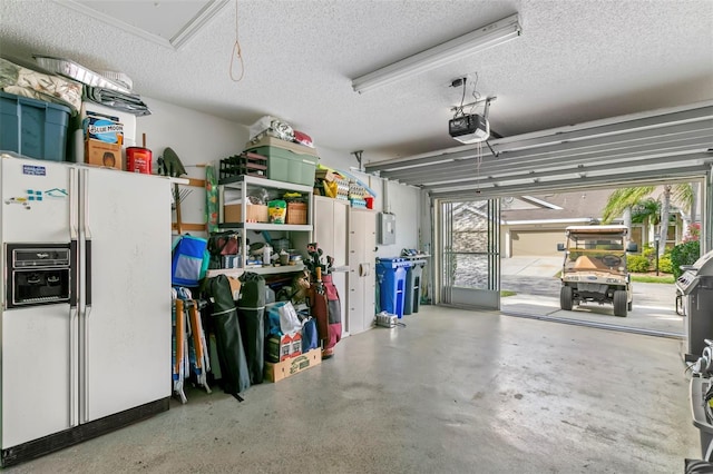 garage featuring white fridge with ice dispenser, electric panel, and a garage door opener