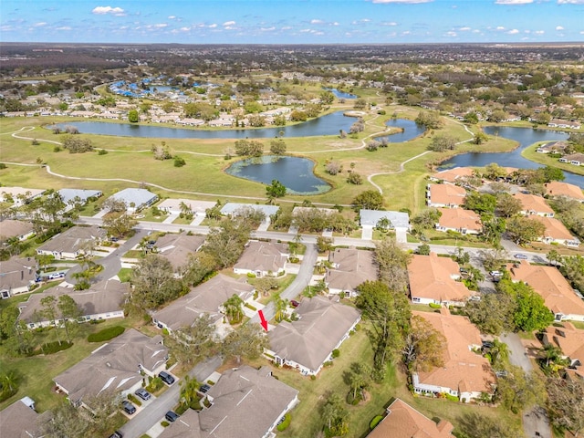 bird's eye view featuring a water view and a residential view