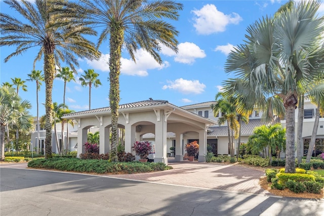 view of property featuring decorative driveway