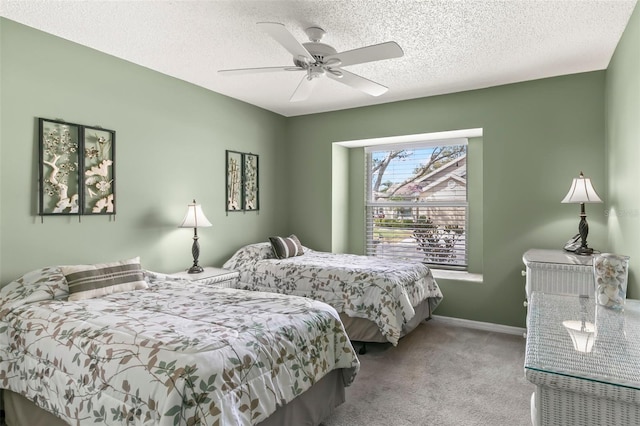 bedroom featuring carpet flooring, ceiling fan, a textured ceiling, and baseboards