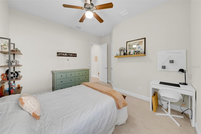 bedroom with a ceiling fan, light carpet, visible vents, and baseboards