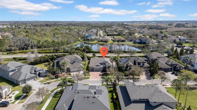 aerial view featuring a water view and a residential view