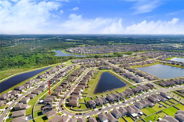 birds eye view of property with a water view and a residential view