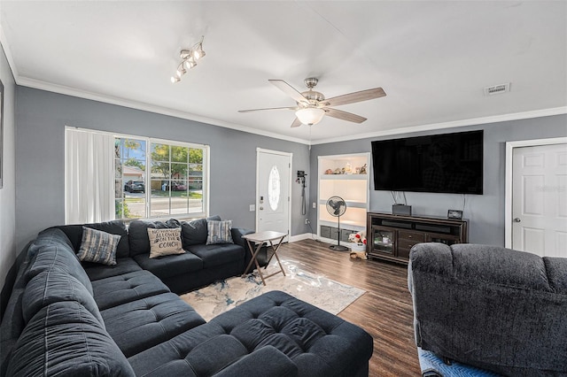 living room with visible vents, a ceiling fan, dark wood finished floors, and crown molding