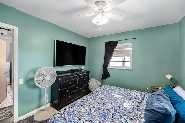 bedroom featuring a ceiling fan, carpet flooring, and baseboards