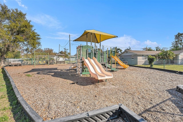 communal playground featuring fence