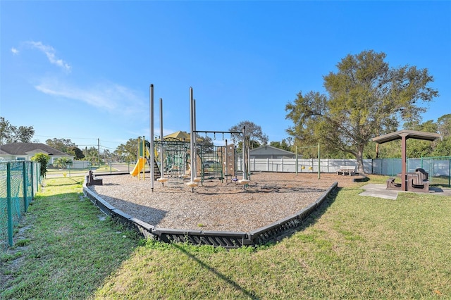 communal playground with fence and a yard