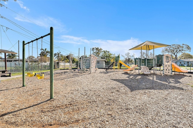 community jungle gym featuring fence