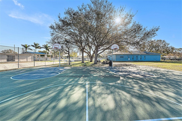 view of sport court with community basketball court and fence