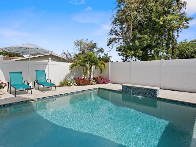 view of swimming pool with a fenced in pool, a fenced backyard, and a patio