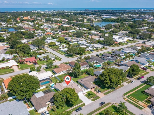 drone / aerial view featuring a water view and a residential view