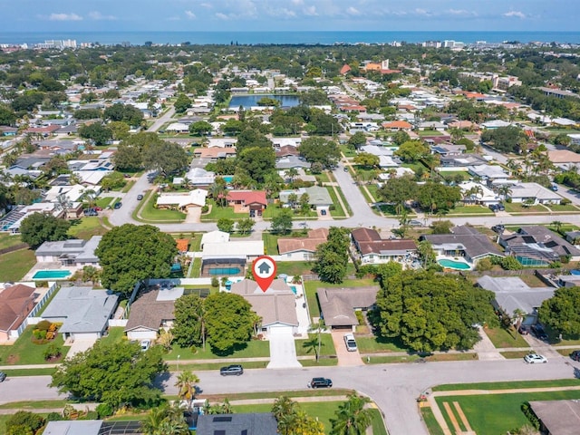 bird's eye view with a water view and a residential view