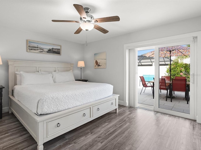 bedroom with access to exterior, dark wood finished floors, baseboards, and a ceiling fan