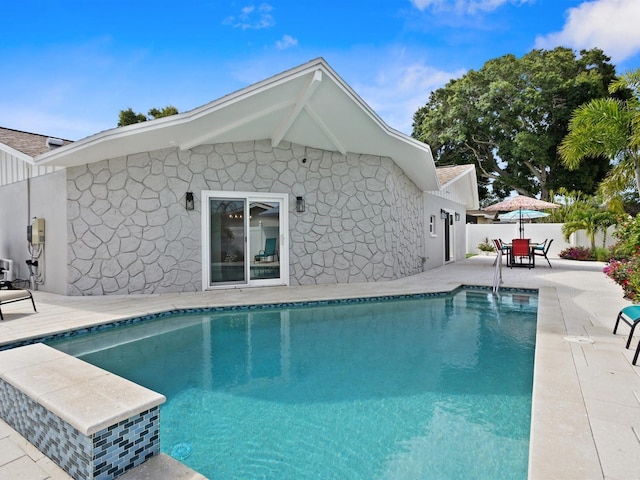 view of pool featuring a fenced in pool, outdoor dining space, a patio, and fence