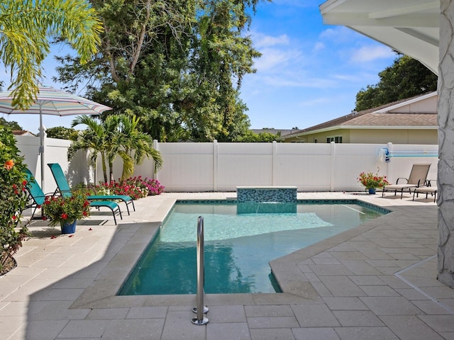 view of pool with a fenced in pool, a fenced backyard, and a patio