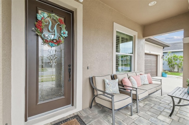 view of exterior entry featuring stucco siding