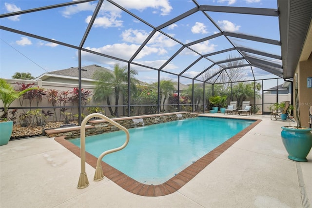 pool with a patio area and glass enclosure