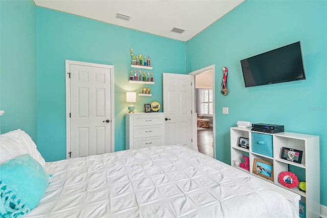 bedroom with visible vents