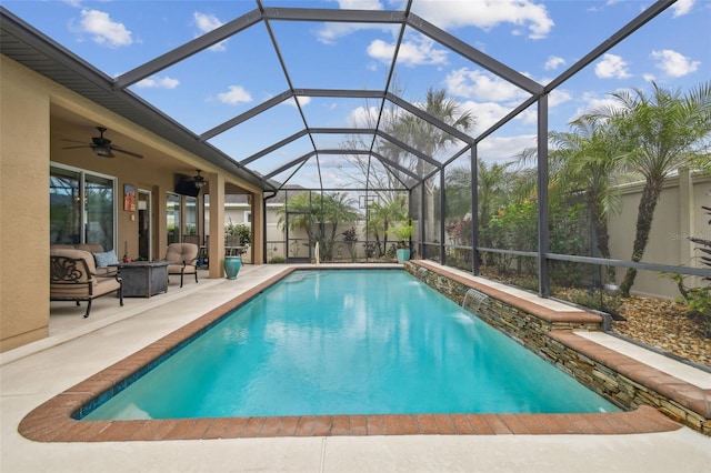 outdoor pool featuring a patio, glass enclosure, outdoor lounge area, and a ceiling fan