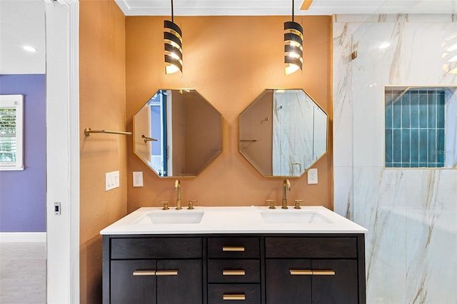 810 22nd St N, Saint Petersburg, FL 33713 - bathroom with double vanity, a sink, and baseboards