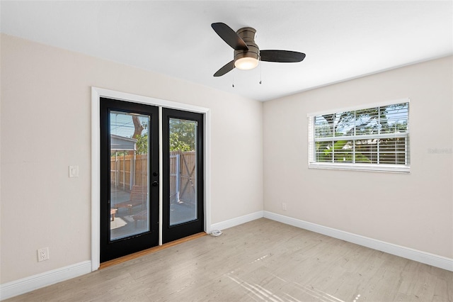810 22nd St N, Saint Petersburg, FL 33713 - spare room with ceiling fan, french doors, wood finished floors, and baseboards