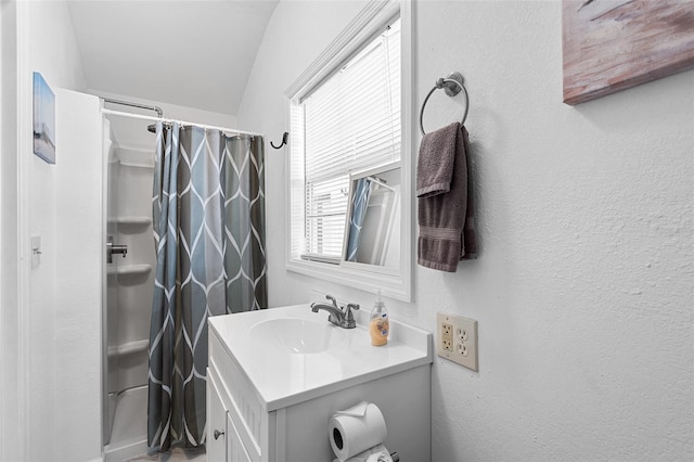 810 22nd St N, Saint Petersburg, FL 33713 - bathroom with curtained shower, a textured wall, and vanity
