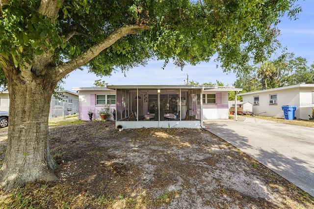 9048 94th St, Seminole, FL 33777 - back of house featuring a sunroom