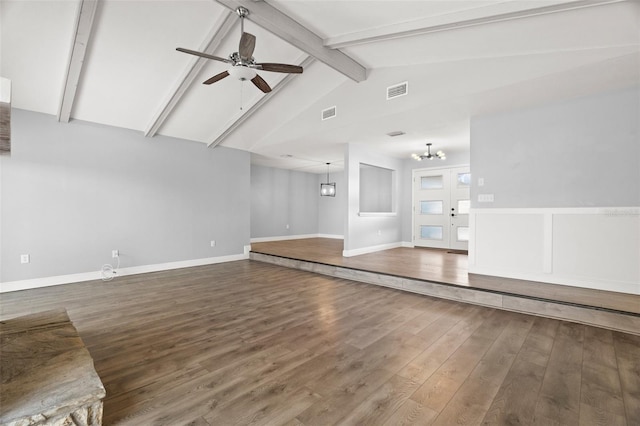 unfurnished living room with vaulted ceiling with beams, ceiling fan with notable chandelier, wood finished floors, visible vents, and baseboards