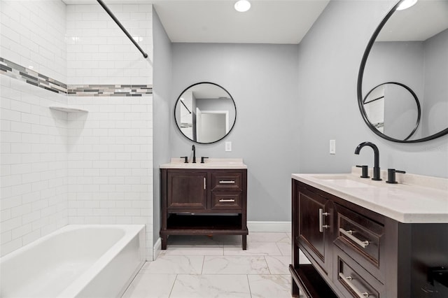 bathroom with shower / bath combination, marble finish floor, baseboards, and a sink