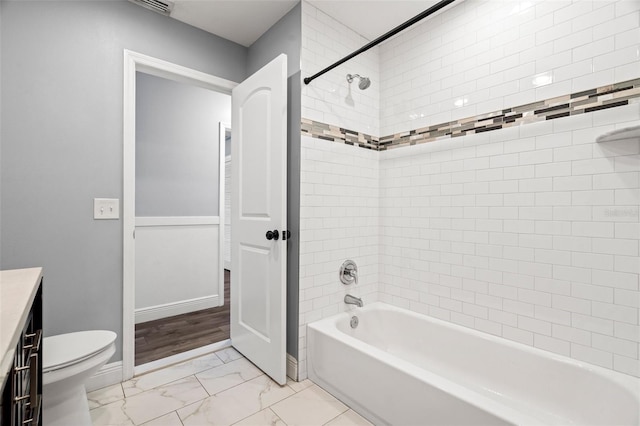 full bath with toilet, vanity, baseboards, marble finish floor, and shower / washtub combination