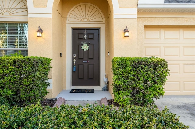 entrance to property with stucco siding