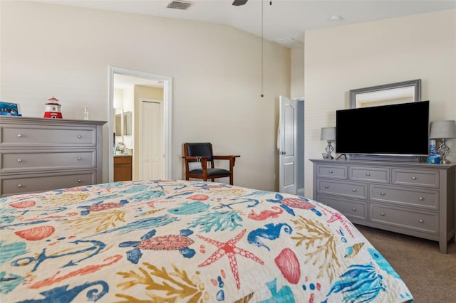 carpeted bedroom featuring lofted ceiling, ensuite bath, visible vents, and a ceiling fan