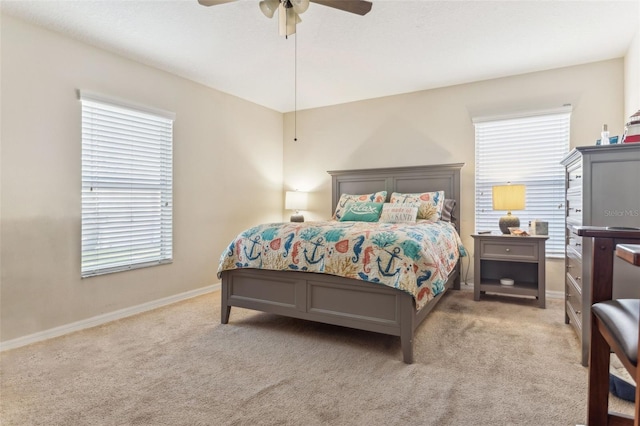 bedroom with ceiling fan, carpet, and baseboards