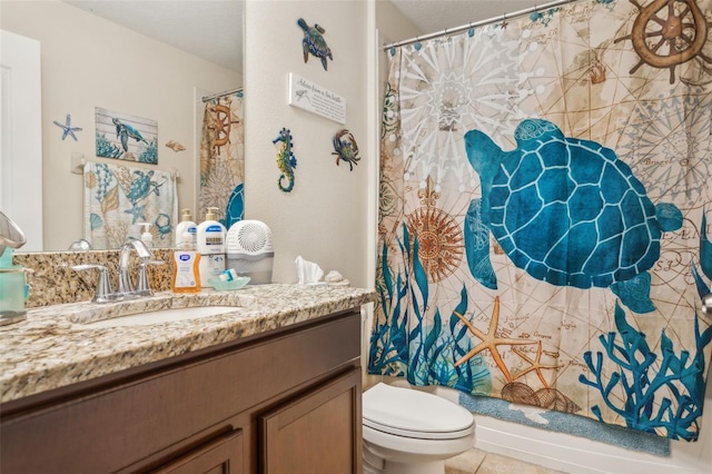 bathroom featuring toilet, tile patterned floors, a shower with shower curtain, and vanity