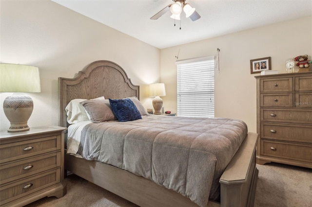 bedroom with ceiling fan and carpet floors