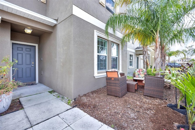 doorway to property with stucco siding