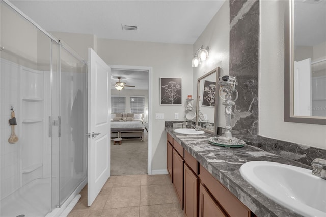 ensuite bathroom featuring a sink, visible vents, tile patterned floors, a stall shower, and ensuite bath