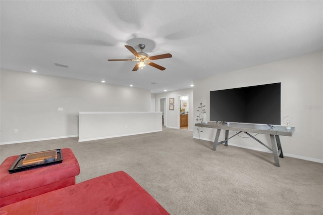 carpeted living area with baseboards, visible vents, a ceiling fan, and recessed lighting