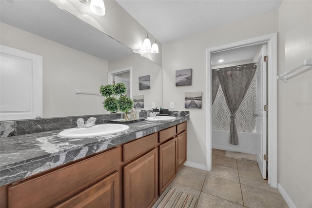 full bathroom featuring double vanity, shower / bath combination with curtain, a sink, and tile patterned floors