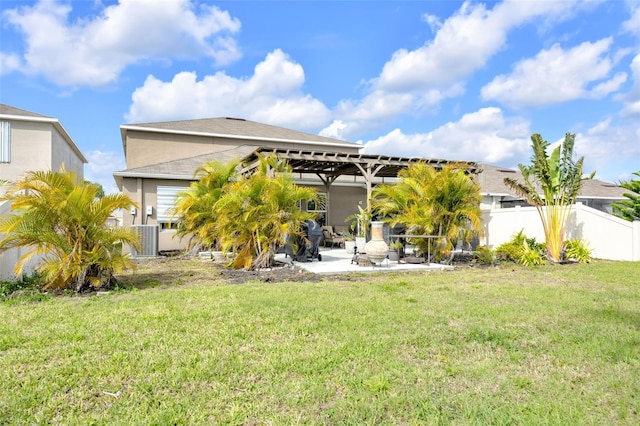 rear view of house with central AC, a patio, a lawn, and fence