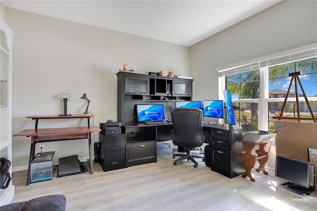 office area with baseboards and wood finished floors