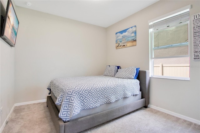 carpeted bedroom with baseboards