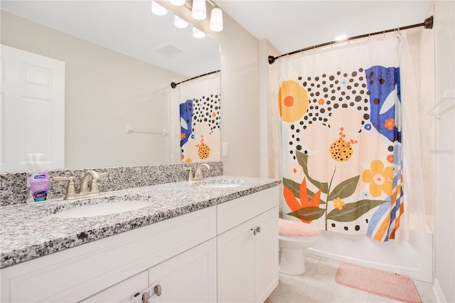 full bath featuring shower / bathtub combination with curtain, double vanity, a sink, tile patterned floors, and toilet