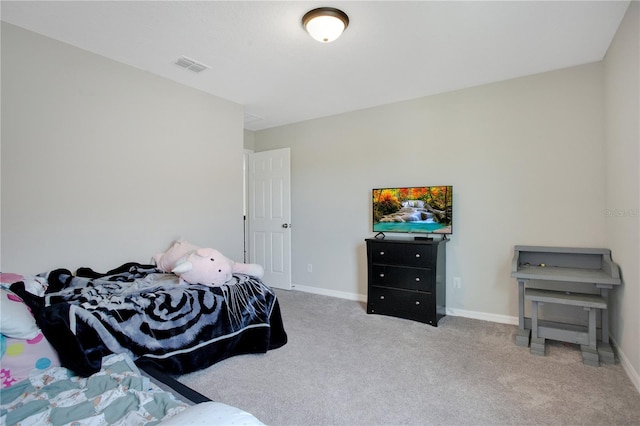 carpeted bedroom with visible vents and baseboards