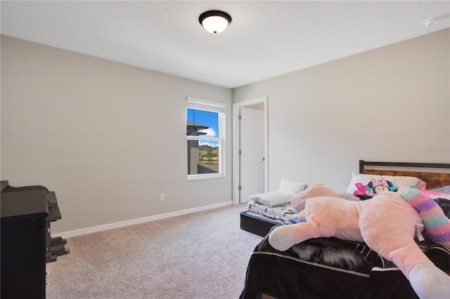 carpeted bedroom with baseboards